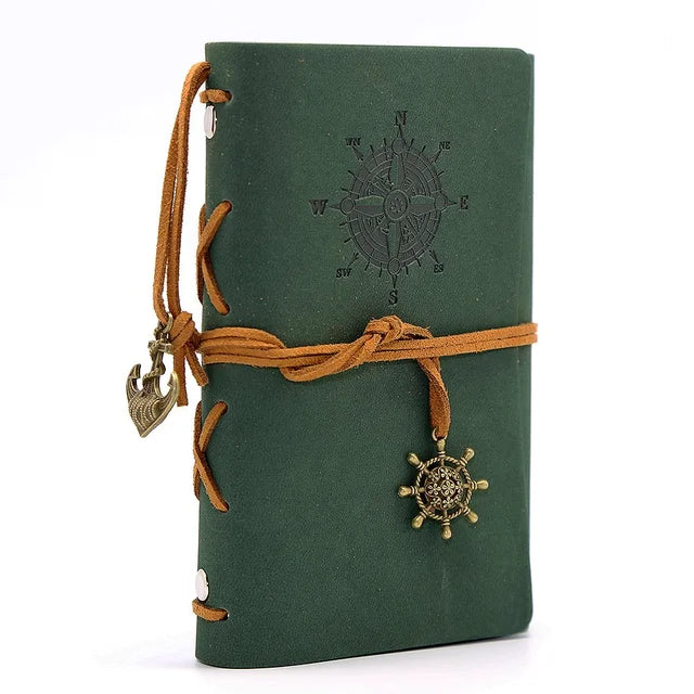Compact leather-bound traveler's journal with replaceable kraft paper notebooks